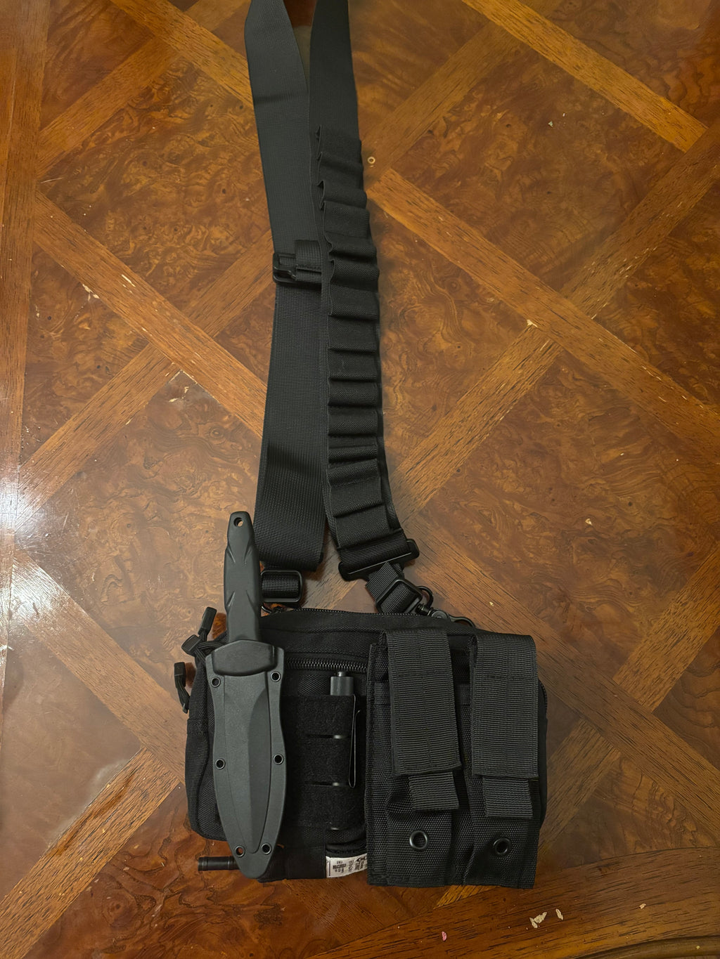 Kit with dual pistol magazine pouch and 15 shotgun shell sling.